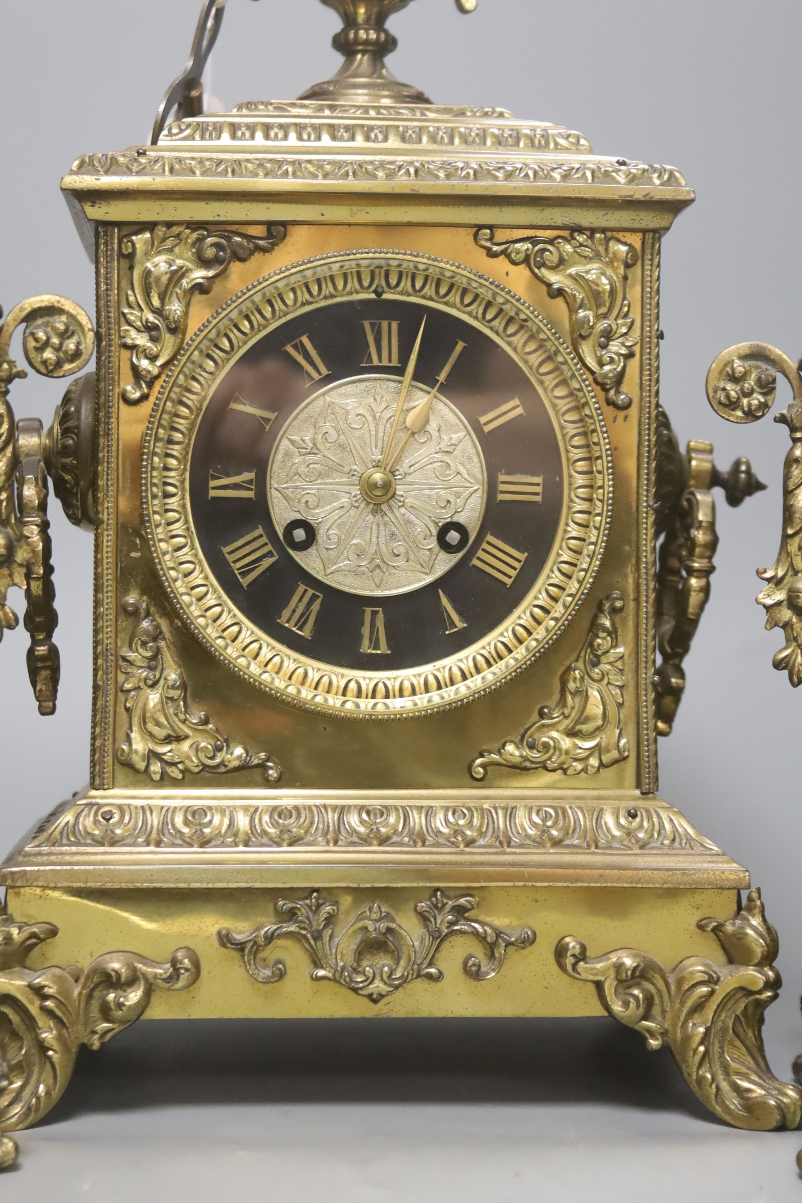 A French brass ornate clock garniture, with French movement, clock height 41cm